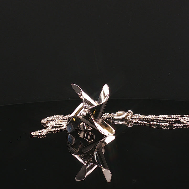 Whirling Memories – The Spinning Top Pendant