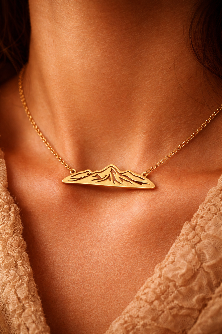 Summit Within – Gold Mountain Silhouette Necklace She wears the mountain —
because she knows how to rise.