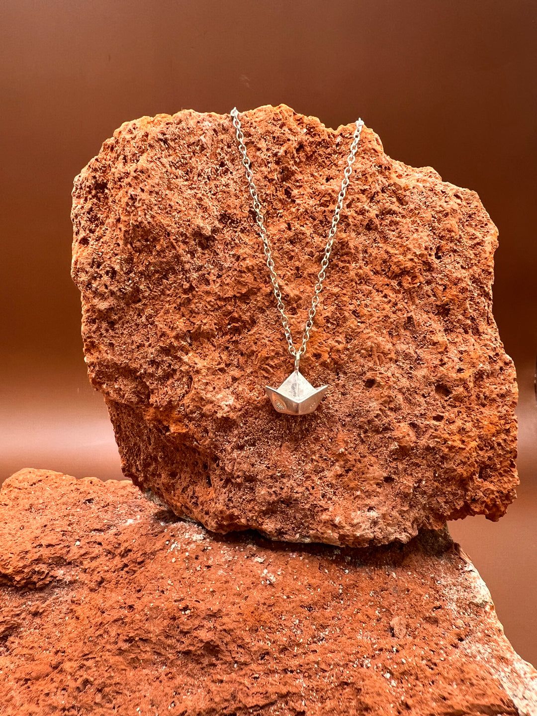 Paper Memory – Origami Boat Necklace A small silver boat, carrying memories across the quiet sea of the heart.