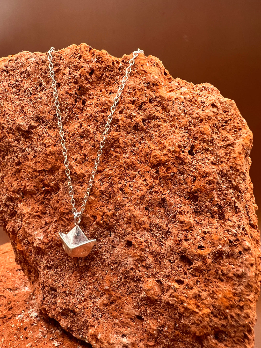 Paper Memory – Origami Boat Necklace A small silver boat, carrying memories across the quiet sea of the heart.