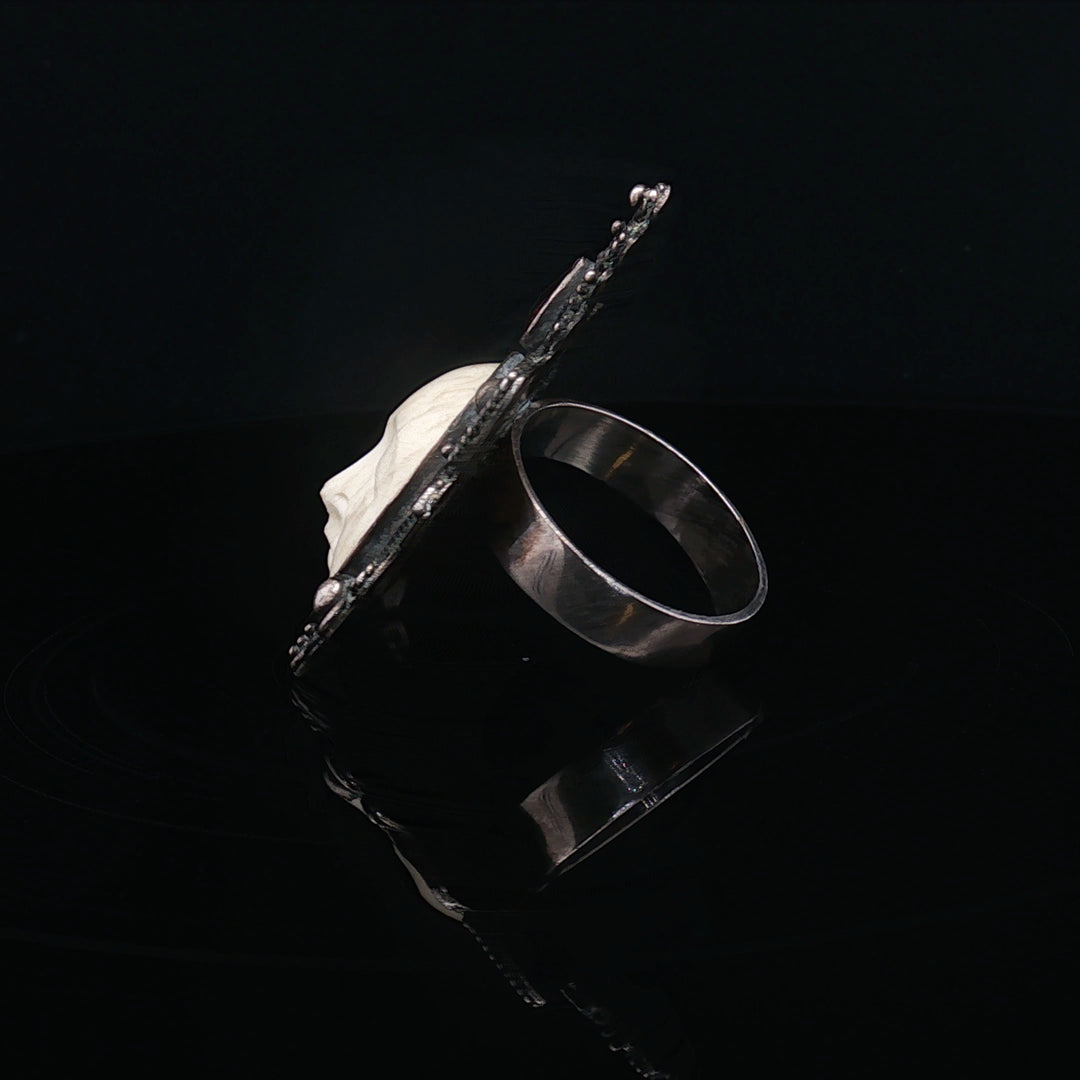 The silnet witness Bone carved face oxidised  silver ring