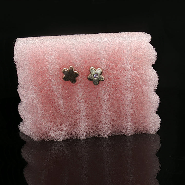 Silent Bloom Studs by Seen by Queen
Handcrafted 14K Gold Flower Earrings with Sapphire Spark
