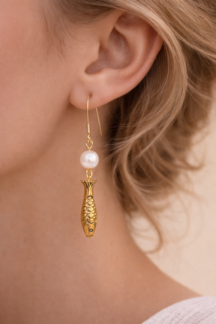 Nordic Ocean Fish Pearl Earrings From the quiet depths of the sea, a small fish carries the story of the ocean.