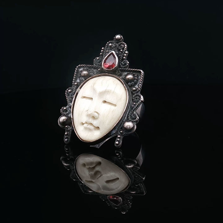 The silnet witness Bone carved face oxidised  silver ring