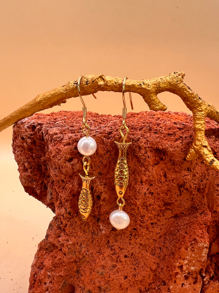 Nordic Ocean Fish Pearl Earrings From the quiet depths of the sea, a small fish carries the story of the ocean.