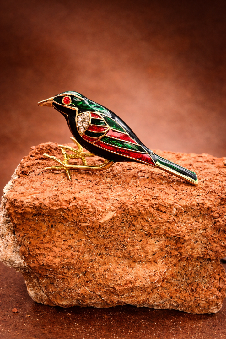 “Scarlet Finch” – Vintage Enamel Bird Brooch “Not perched — but poised,
grounded in gold, ready for flight.”