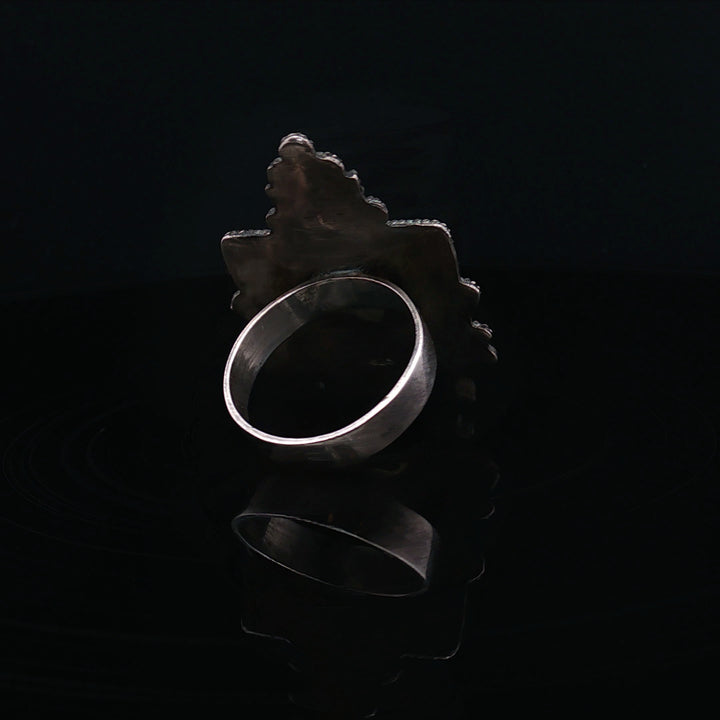 The silnet witness Bone carved face oxidised  silver ring