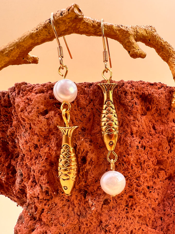 Nordic Ocean Fish Pearl Earrings From the quiet depths of the sea, a small fish carries the story of the ocean.