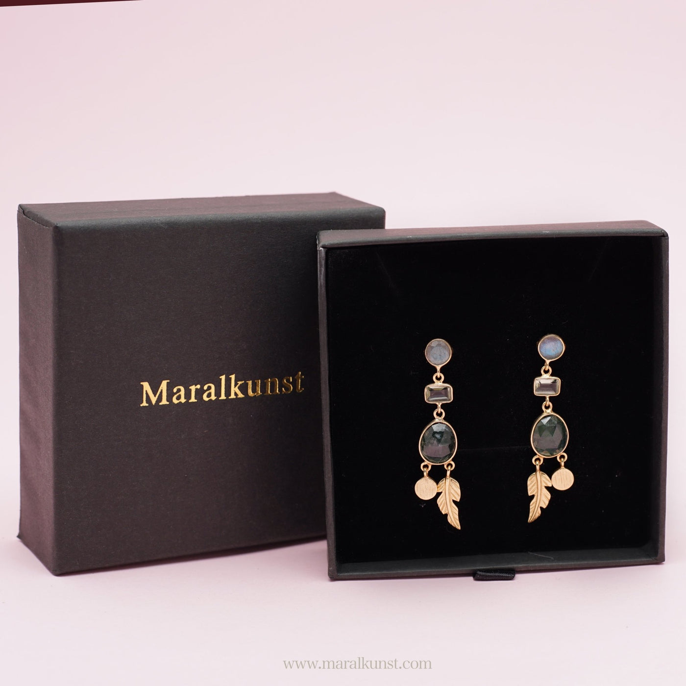 a Labradorite Gemstone Earrings in 925 sterling silver is displaying in the stone