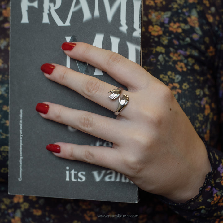 a hand shape ring in stainless steel 