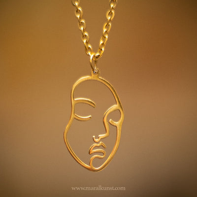 Face gold plated necklace