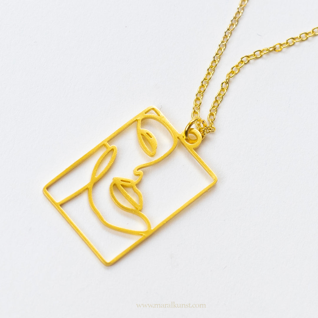 Minimal abstract face necklace