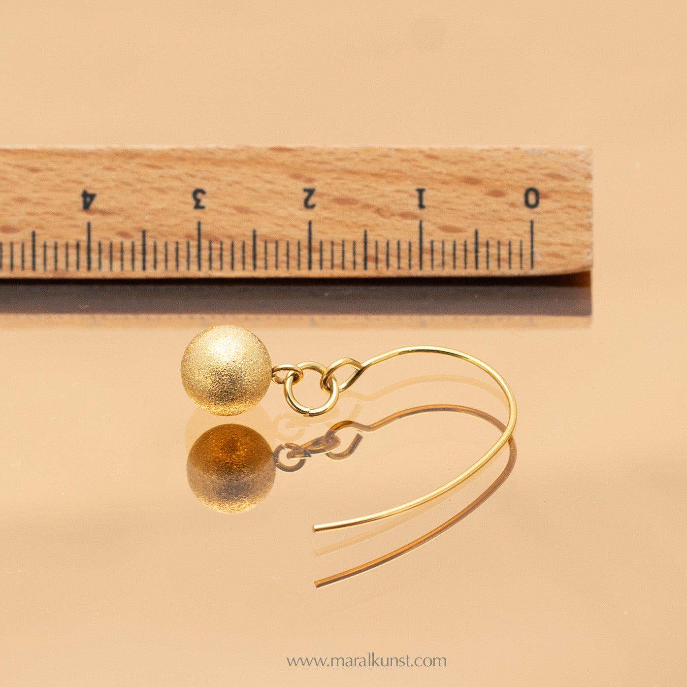 Ball gold plated steel earrings