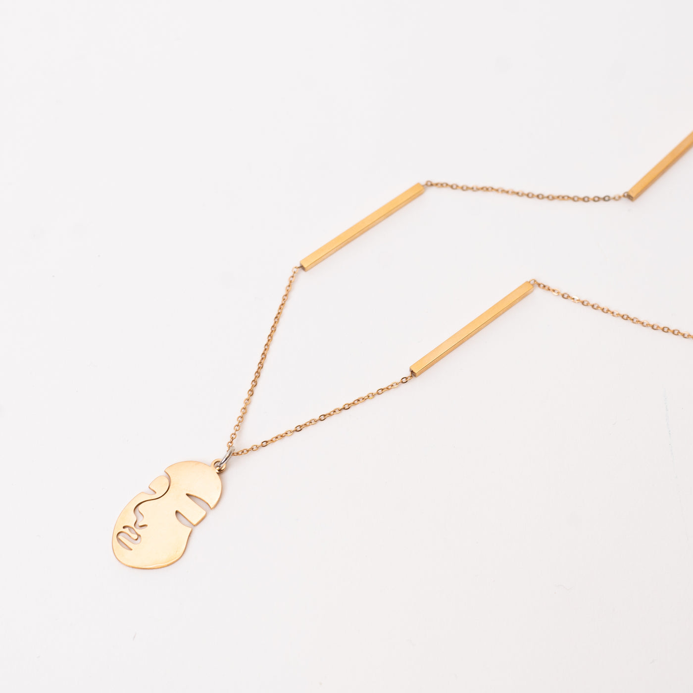 Rose gold face necklace