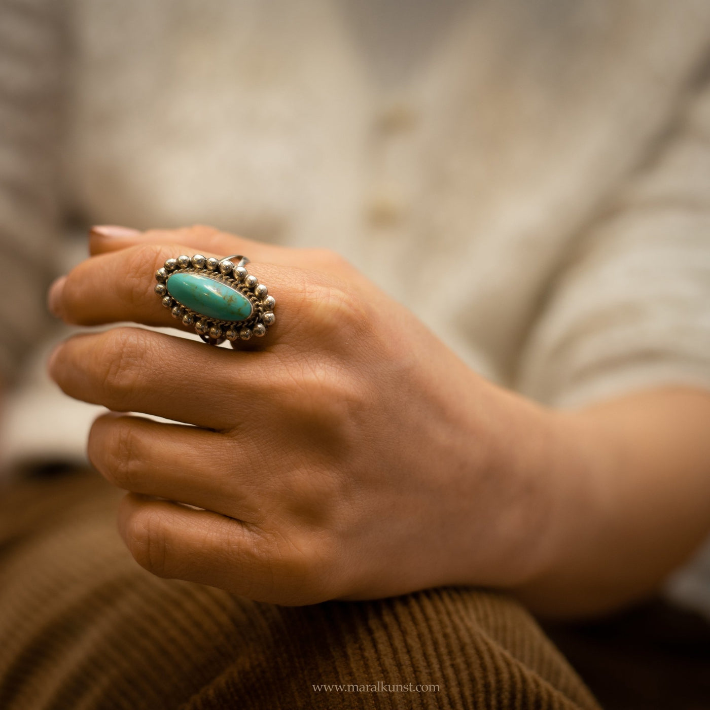 a women wears a Mexican ring in sterling silver 
