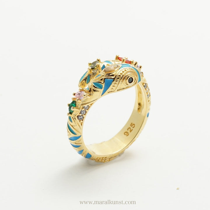 a snake shape ring in 925 sterling silver is putting on the table